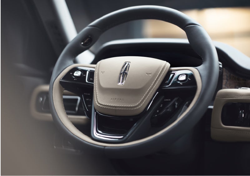 The intuitively placed controls of the steering wheel on a 2023 Lincoln Aviator® SUV | Pinnacle Lincoln in Nicholasville KY