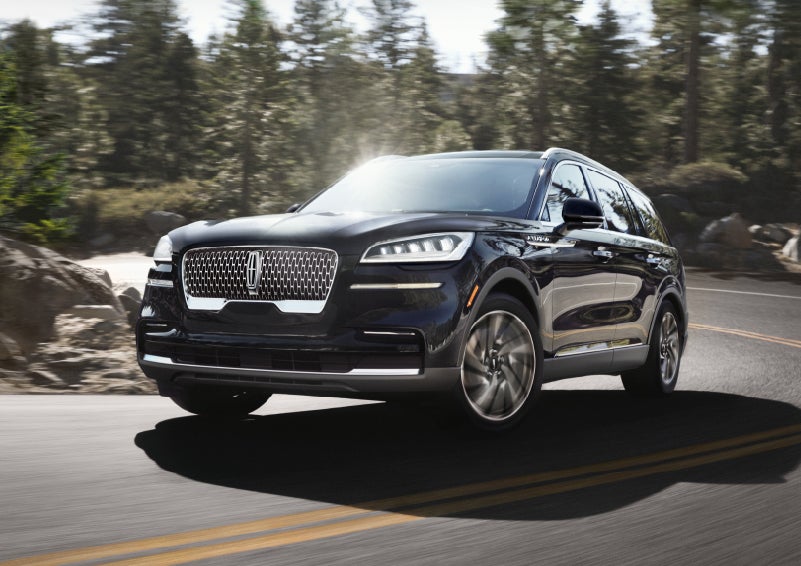 A Lincoln Aviator® SUV is being driven on a winding mountain road | Pinnacle Lincoln in Nicholasville KY
