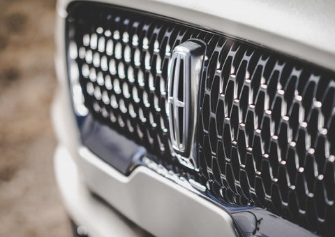 The grille of the 2024 Lincoln Aviator® Reserve model with an eye-catching repeated field of Lincoln Star logo shapes | Pinnacle Lincoln in Nicholasville KY