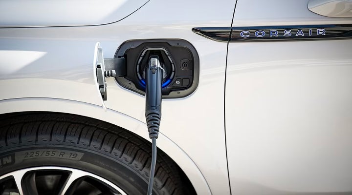 An electric charger is shown plugged into the charging port of a Lincoln Corsair® Grand Touring
model. | Pinnacle Lincoln in Nicholasville KY