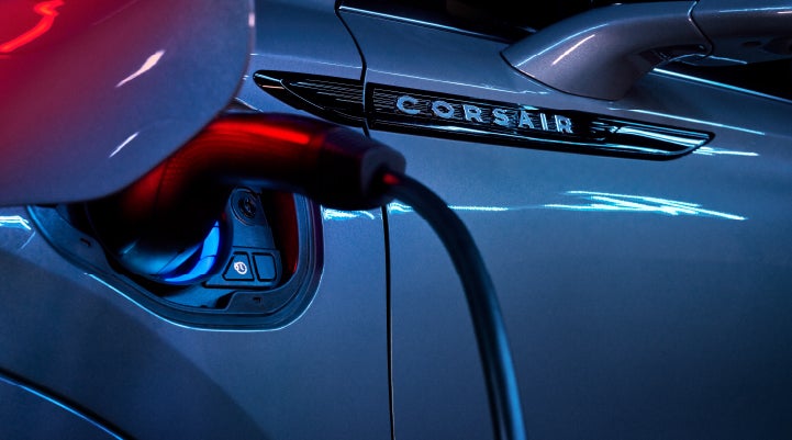 A charger plugged into the charging port of a 2024 Lincoln Corsair® Plug-in Hybrid model. | Pinnacle Lincoln in Nicholasville KY